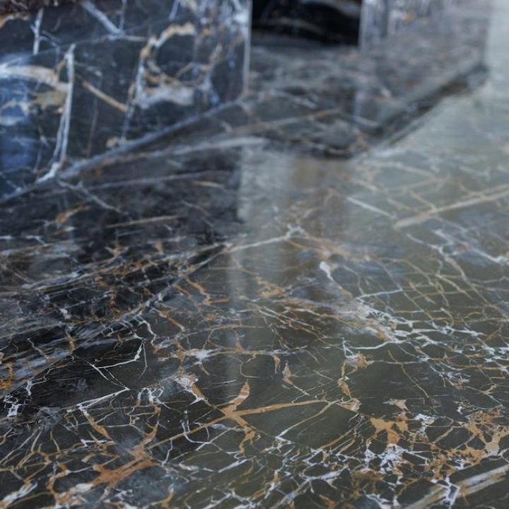 Work with Cincinnati Marble Floor Maintenance experts at Midwest Floor Restore image shows dark marble floor